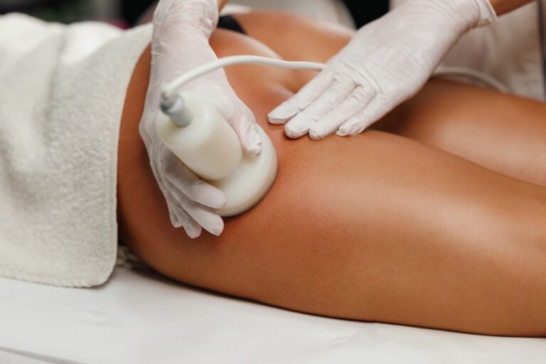 Shot of a unrecognizable woman getting a anti cellulite massage at the beauty salon. She have a ultrasound cavitacion treatment to fat reduction.